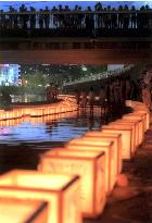 Lanterns float down river for Nagasaki A-bomb victims